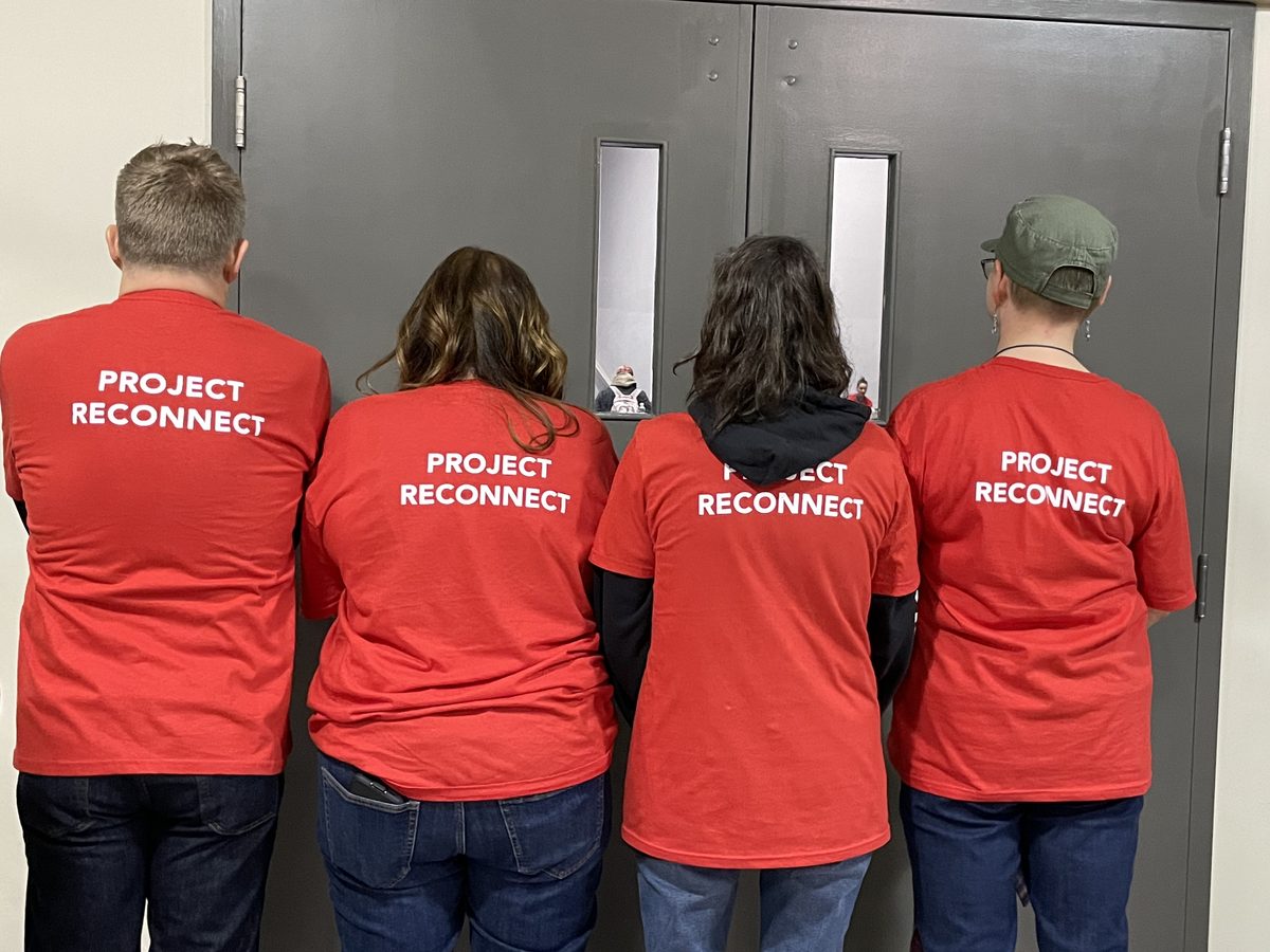 Volunteers wearing Project ReConnect shirts