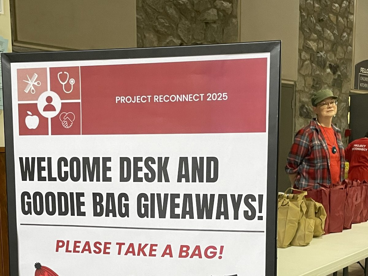 Welcome desk and goodie bag giveaways sign